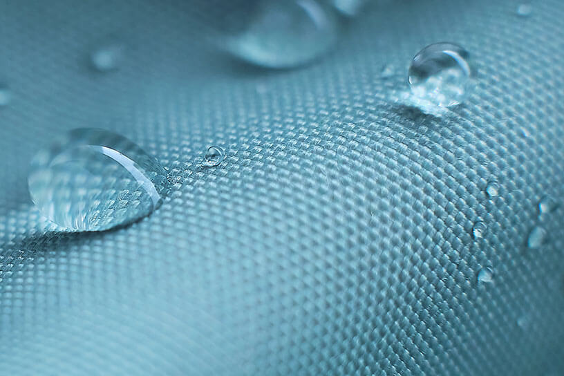 Water drops on white-blue waterproof Zeus non-woven fabric